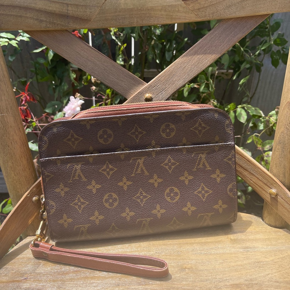 Authentic LOUIS VUITTON  Pochette Orsay Monogram Canvas.